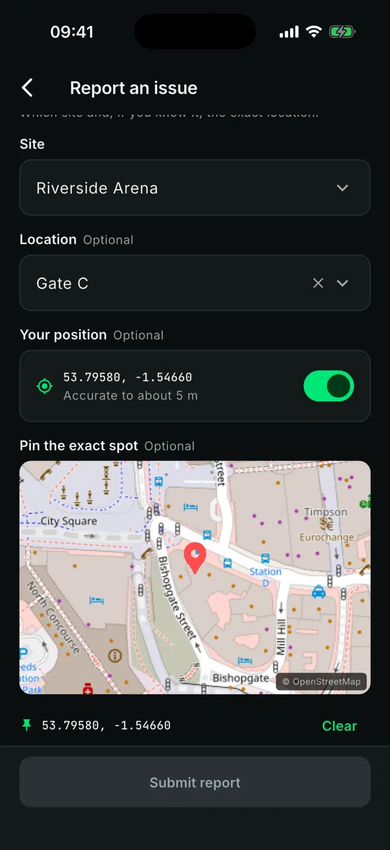 The report form with Riverside Arena, Gate C, the phone's position switched on and a pin dropped on the map.